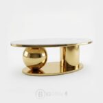Table basse contemporaine avec plateau en céramique et base dorée sculpturale.